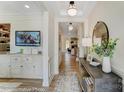 Elegant home foyer with hardwood floors, tray ceilings, stylish decor and natural lighting at 8618 Frank Grier Rd # 58, Charlotte, NC 28215
