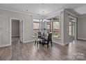 Bright dining area with large windows showcasing the outdoor scenery at 9087 Treetop Nw Way, Concord, NC 28027