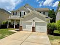 Attractive two-story home features a two-car garage, well-maintained lawn, and inviting curb appeal at 9419 Seamill Rd, Charlotte, NC 28278