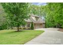 Beautiful home with a well-maintained lawn, long driveway, and attached garage perfect for suburban living at 112 Spring Branch Rd, Fort Mill, SC 29715