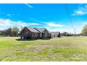 Expansive yard surrounds this brick home with a detached garage, perfect for outdoor enjoyment at 115 Green Sw St, Concord, NC 28027
