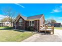 Classic brick home featuring a convenient access ramp, enhancing accessibility and comfort at 115 Green Sw St, Concord, NC 28027