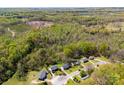 An aerial view showcasing a neighborhood surrounded by lush forests at 116 Ridgewood Dr, York, SC 29745