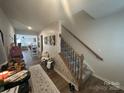 Inviting entryway with wood floors, stairs, decor and views into other living spaces at 120 Parson Ln, Statesville, NC 28625