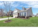 Well-maintained single-Gathering home with lush green lawn and mature tree in a lovely neighborhood at 1224 Horsesugar Rd, Clover, SC 29710