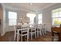 Elegant dining room showcasing a large table and an eye-catching chandelier at 136 Morgans Branch Rd, Belmont, NC 28012