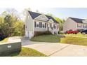 Inviting home with a two-car garage, extended driveway, manicured lawn, and a welcoming front entrance at 1527 Meadow Glen Ln, Rock Hill, SC 29730