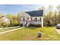 Well-maintained home with an inviting walkway, green lawn, and vibrant trees offering a peaceful setting at 1527 Meadow Glen Ln, Rock Hill, SC 29730