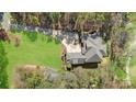 Areal view of home with manicured lawn, mature trees, and a circular driveway at 1754 Brawley School Rd, Mooresville, NC 28117