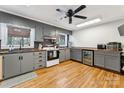 Well-appointed kitchen featuring updated appliances, lots of cabinets, and hardwood floors at 237 Palaside Ne Dr, Concord, NC 28025