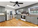 Spacious kitchen with stainless steel appliances, hardwood floors, and ample counter space at 237 Palaside Ne Dr, Concord, NC 28025