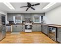 Updated kitchen with stainless steel appliances, hardwood floors, and custom cabinetry at 237 Palaside Ne Dr, Concord, NC 28025