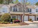 Charming two-story townhome with a well-manicured lawn and an attached one-car garage at 475 Delta Dr, Fort Mill, SC 29715