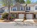 Charming two-story townhome with a well-manicured lawn and an attached one-car garage at 475 Delta Dr, Fort Mill, SC 29715