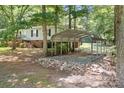 Carport attached to the home providing covered parking and protection from the elements, nestled among mature trees at 6575 Charlotte Hwy, York, SC 29745