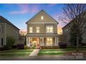 Charming two-story home with a welcoming front porch and landscaped front yard at 1117 Cedar Park Dr, Pineville, NC 28134
