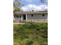 Quaint one-story home with grey brick, a cozy front porch, and lawn at 1204 Borders Rd, Shelby, NC 28150