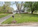 Exterior view of a well-manicured lawn and home with a long driveway and mailbox at 1555 Ridgewood Dr, Gastonia, NC 28054