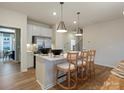 Bright kitchen with stainless appliances, center island, and four bar stools at 2014 Puddle Pond Rd, Indian Trail, NC 28079