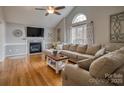 Comfortable living room featuring a fireplace, large window, and stylish decor at 3704 25Th Street Ne Pl, Hickory, NC 28601