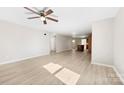 Spacious living room featuring modern flooring and an open layout to kitchen and dining areas at 416 E Park Ave, Gastonia, NC 28054