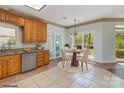 Eat-in kitchen featuring light cabinets, granite countertops, and stainless steel appliances at 7900 Gilead Rd, Huntersville, NC 28078