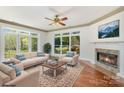 Living room showcasing a fireplace, natural light, and comfortable seating at 7900 Gilead Rd, Huntersville, NC 28078