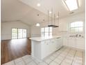 Open kitchen design with island, pendant lighting, and modern appliances at 9287 Meadow Vista Rd, Charlotte, NC 28213