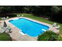 Backyard in-ground swimming pool with diving board, chairs and fenced-in yard at 101 Saddletree Rd, Lincolnton, NC 28092