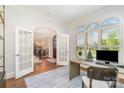 Bright office space with French doors, arched windows, and hardwood floors at 1029 Seminole Dr, Waxhaw, NC 28173
