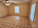 Spacious living room with tile flooring and abundant natural light at 109 Starnes St, Chester, SC 29706