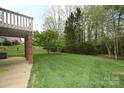 Enjoy a private backyard with lush lawn and mature trees, perfect for relaxing at 1353 33Rd Avenue Ne Dr, Hickory, NC 28601