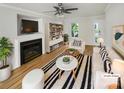 Bright living room with hardwood floors, fireplace, and stylish furniture at 15188 Eric Kyle Dr, Huntersville, NC 28078