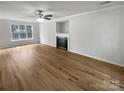 Spacious living room with hardwood floors and a fireplace at 15188 Eric Kyle Dr, Huntersville, NC 28078