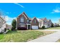 Beautiful two-story brick home with a manicured lawn, two car garage and inviting curb appeal at 2275 Laurens Dr, Concord, NC 28027