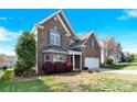 Charming two-story brick home with a two-car garage and well-maintained landscaping at 2275 Laurens Dr, Concord, NC 28027