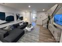 A bright living room featuring modern decor, stylish furniture, and hardwood floors at 248 Laura Elizabeth Ln, Clover, SC 29710