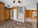 The living room features stairs to the upper level, a closet, and tiled floors at 2614 Reepsville Rd, Lincolnton, NC 28092