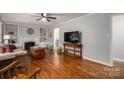 Bright living room showcasing a fireplace, hardwood floors, and ample natural light at 2617 Brookwood Rd, Lincolnton, NC 28092