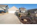 Spacious two-car garage with long driveway, fenced-in yard, and easy access to the home at 530 Kiser Ln, Locust, NC 28097