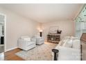 Spacious living room featuring hardwood floors, comfortable seating, and tasteful decor, creating an inviting space at 5329 Glenbrier Dr, Charlotte, NC 28212