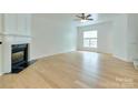 Spacious living room with hardwood floors, fireplace and a large window at 5430 Dockery Dr, Charlotte, NC 28209