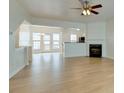 Open-concept living room with hardwood floors, fireplace and lots of natural light at 5430 Dockery Dr, Charlotte, NC 28209