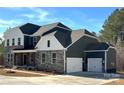 Beautiful two-story home with attached two car garage and lovely landscaping at 7001 New Town Rd, Waxhaw, NC 28173