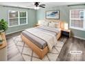 Relaxing bedroom featuring a comfortable bed, soft lighting and two windows that provide natural light at 1082 Wallace Lake Rd, Fort Mill, SC 29707