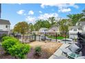 This view showcases a fenced-in backyard and neighborhood street views at 1112 Drummond Ave, Charlotte, NC 28205