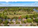 Aerial view of the home highlighting the property and neighborhood near the green golf course at 12531 Kane Alexander Dr, Huntersville, NC 28078