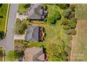 Aerial view of the home showcasing the backyard patio area and neighborhood at 12531 Kane Alexander Dr, Huntersville, NC 28078