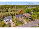 Aerial view of the home showcasing the property, surrounding golf course and lush landscape at 12531 Kane Alexander Dr, Huntersville, NC 28078