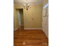 View of the entryway with hardwood floors and a chandelier at 127 Victoria Park Dr, Shelby, NC 28150